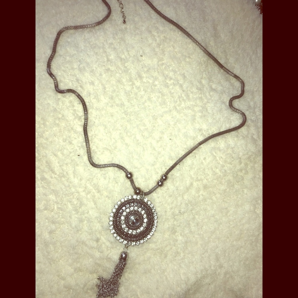 Long pendant and tassel necklace